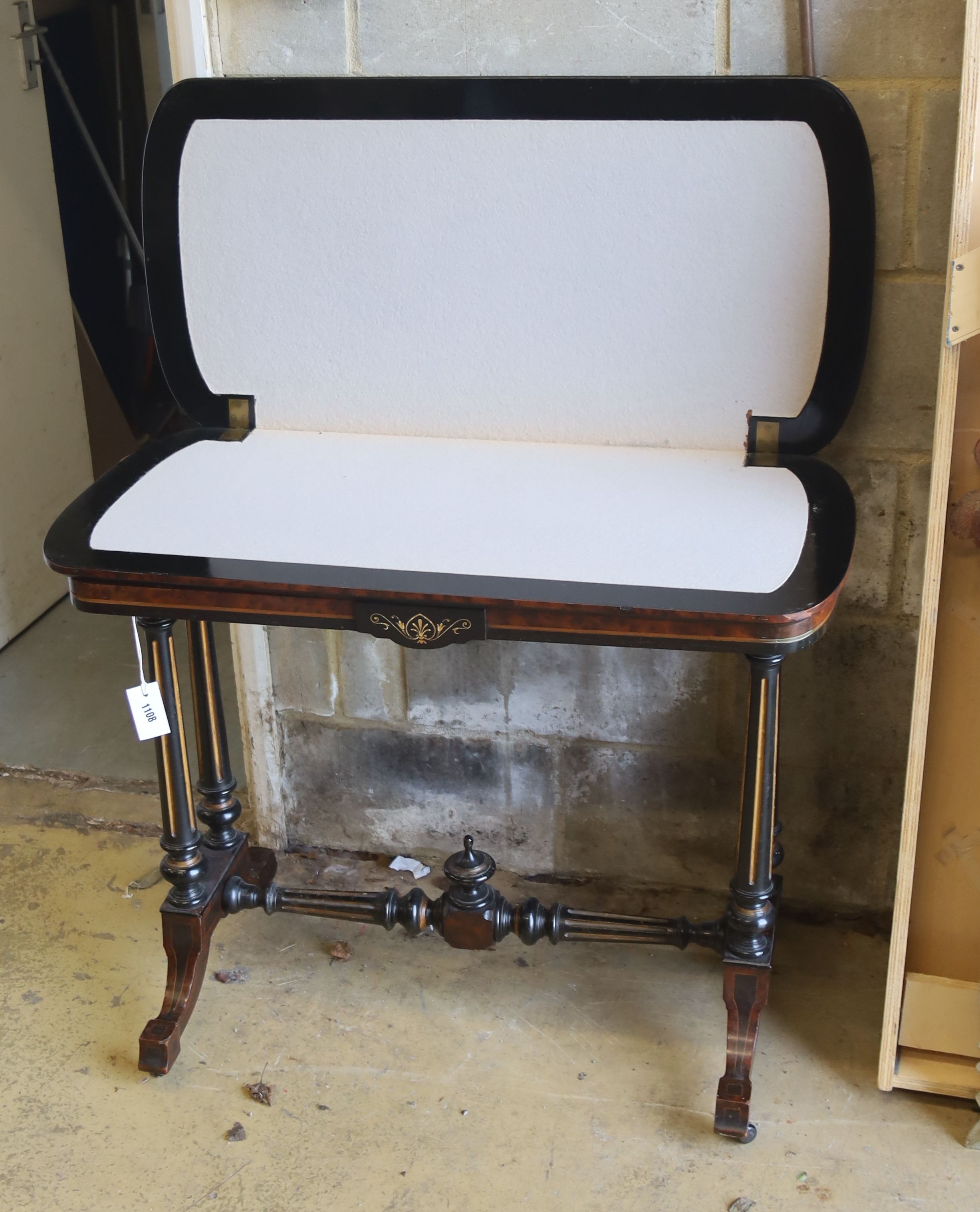 A Victorian inlaid part embonised Amboyna rectangular folding card table, width 90cm, depth 45cm, height 74cm
